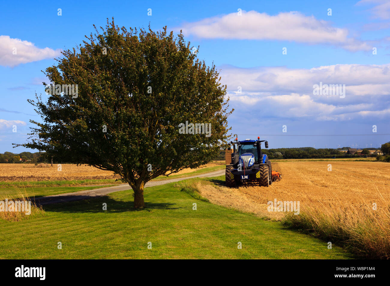Cultivating farm fields following harvesting the crops in Lincolnshire