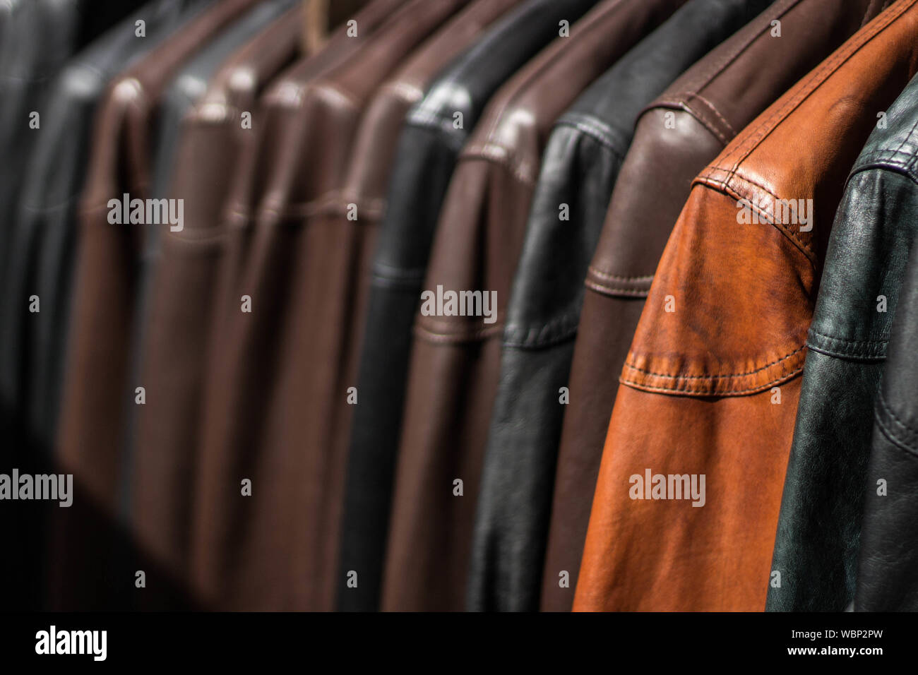 Full Frame Shot Of Leather Jackets For Sale In Clothing Store Stock Photo