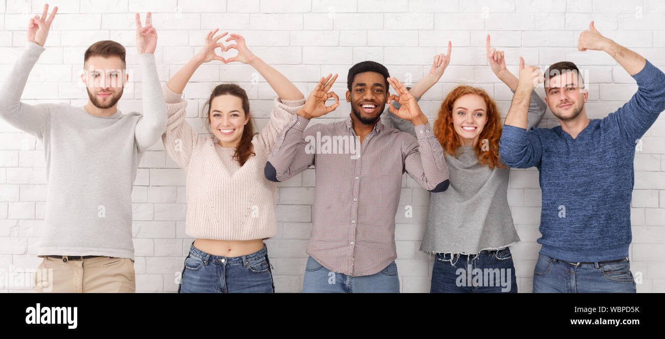 Attractive group young friends signs hi-res stock photography and images -  Alamy