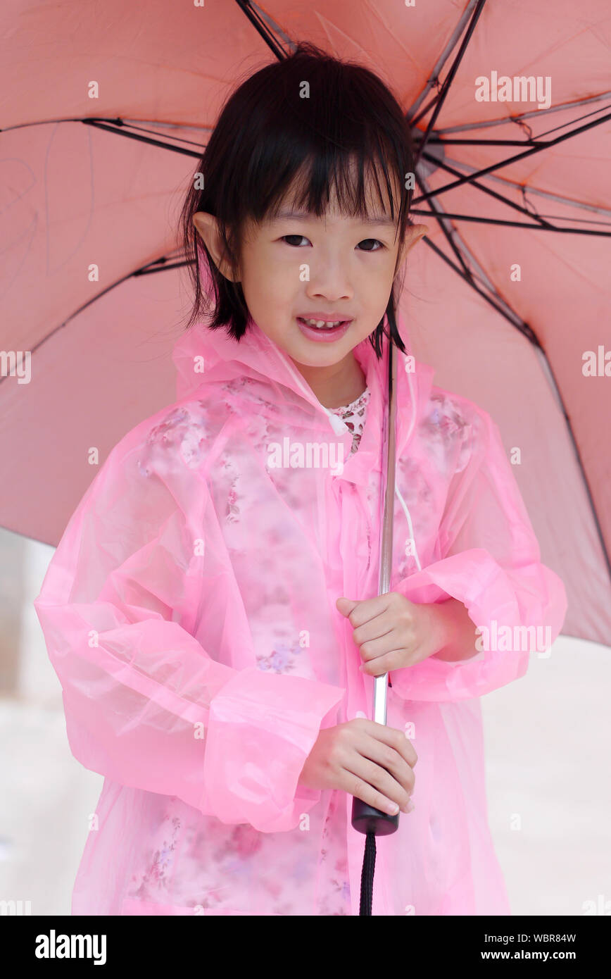 Pink Raincoat Girl High Resolution Stock Photography and Images Alamy