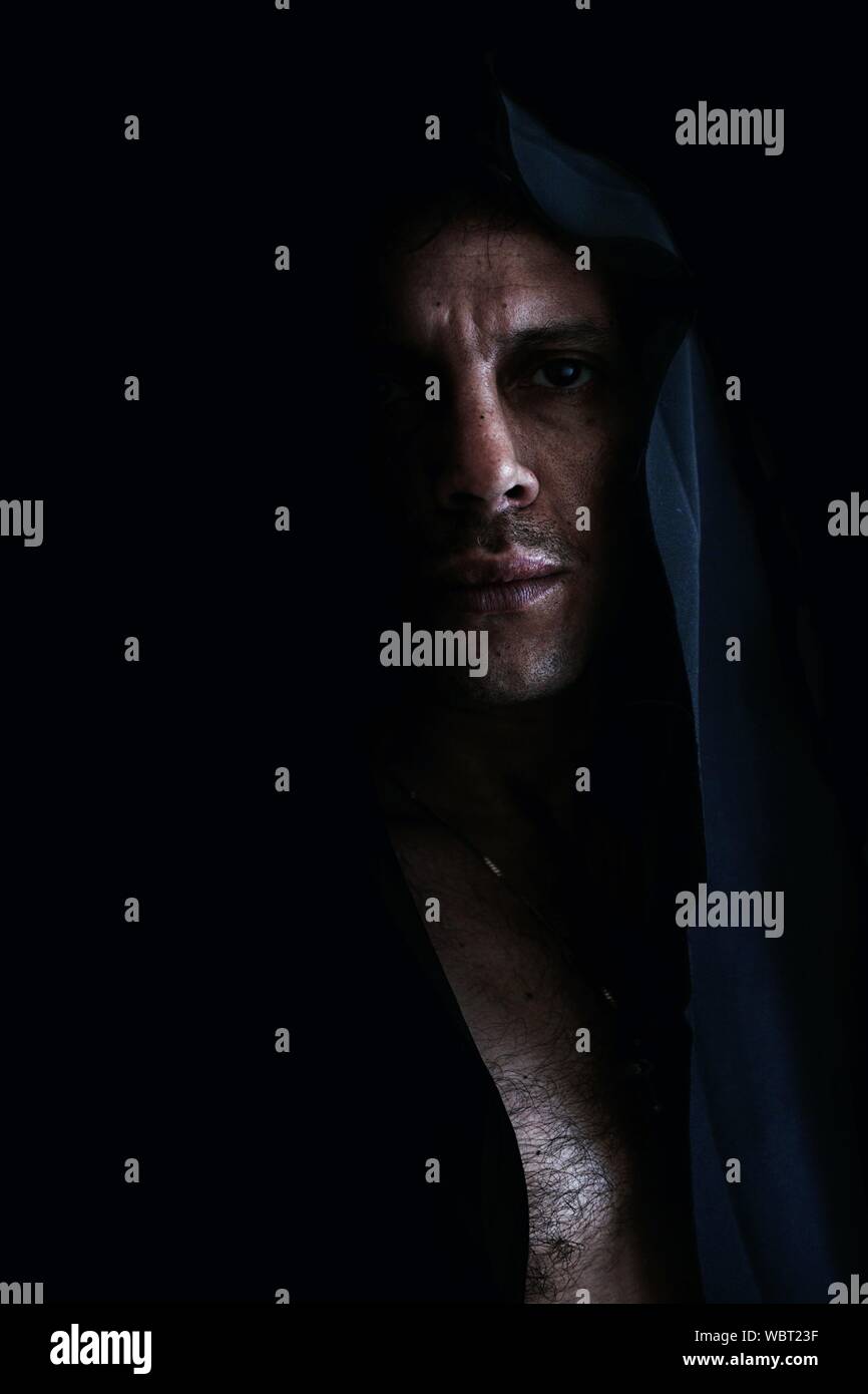 Dark man with hood up hi-res stock photography and images - Alamy