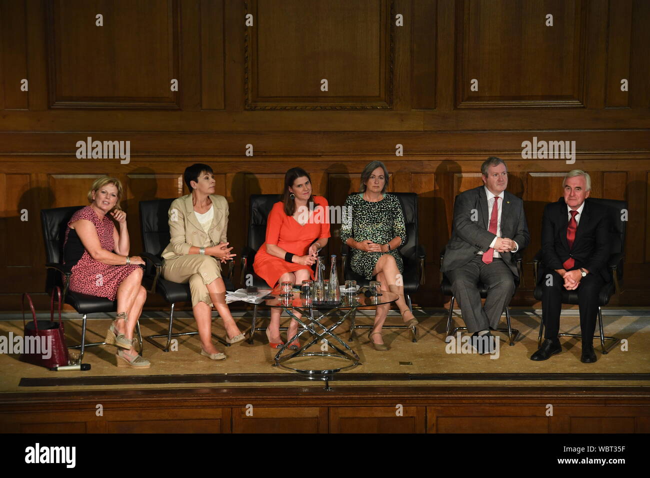 (left to right) Anna Soubry, Caroline Lucas, Jo Swinson, Liz Saville Roberts, Ian Blackford and John McDonnell during a meeting of a cross-party group of MPs at Church House, Westminster, where they will sign a declaration saying they will continue to meet as an alternative House of Commons if Prime Minister Boris Johnson temporarily shuts down Parliament to get a no-deal Brexit through. Stock Photo