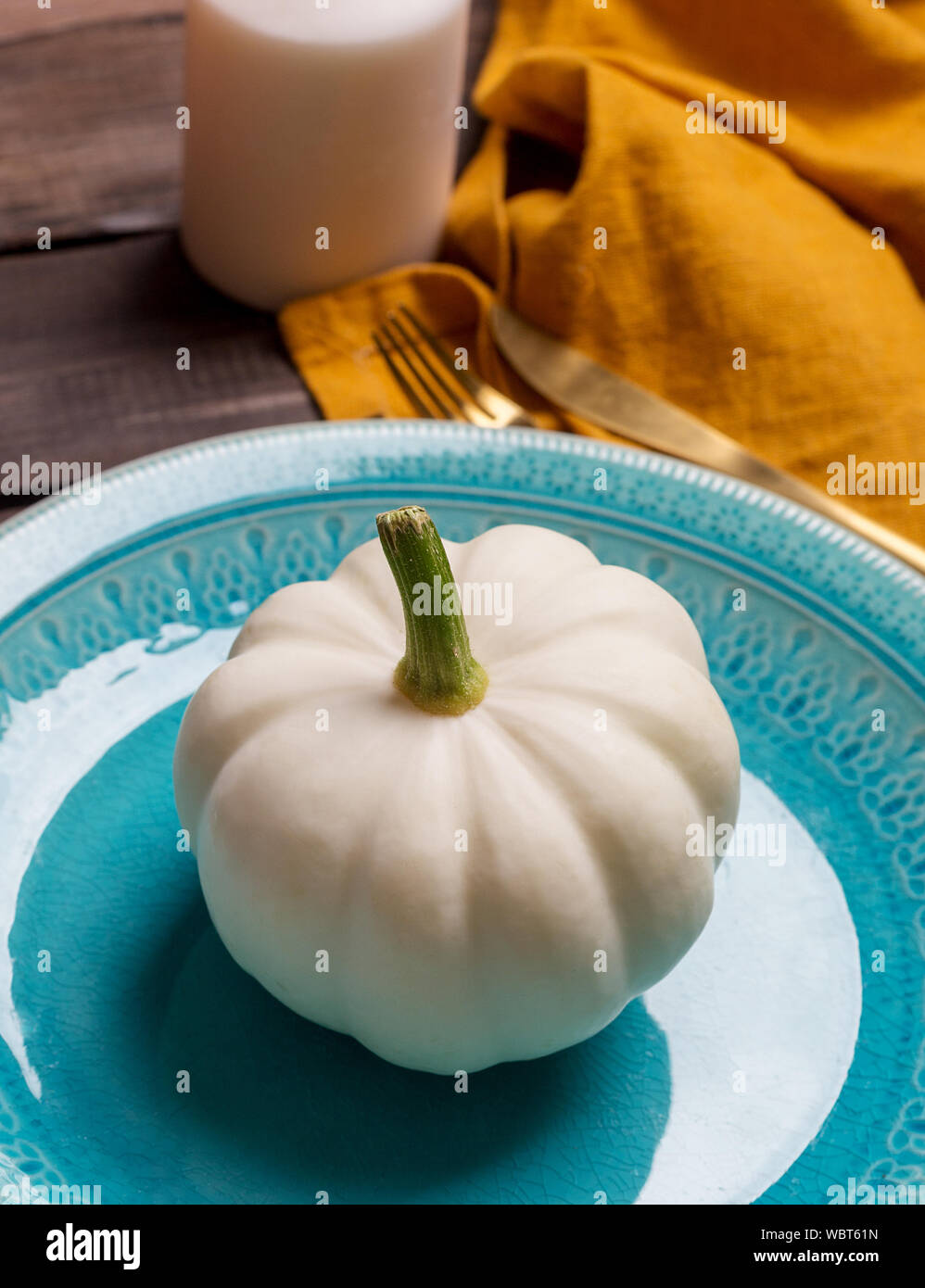 Close up decor white mini pumpkin on blue dish. Concept of seasonal ...