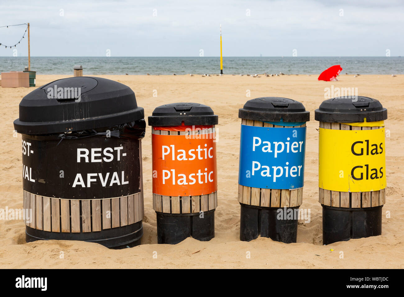 Recycling bins on the beach, seaside resort of Scheveningen near The Hague, South Holland, Netherlands, Europe Stock Photo
