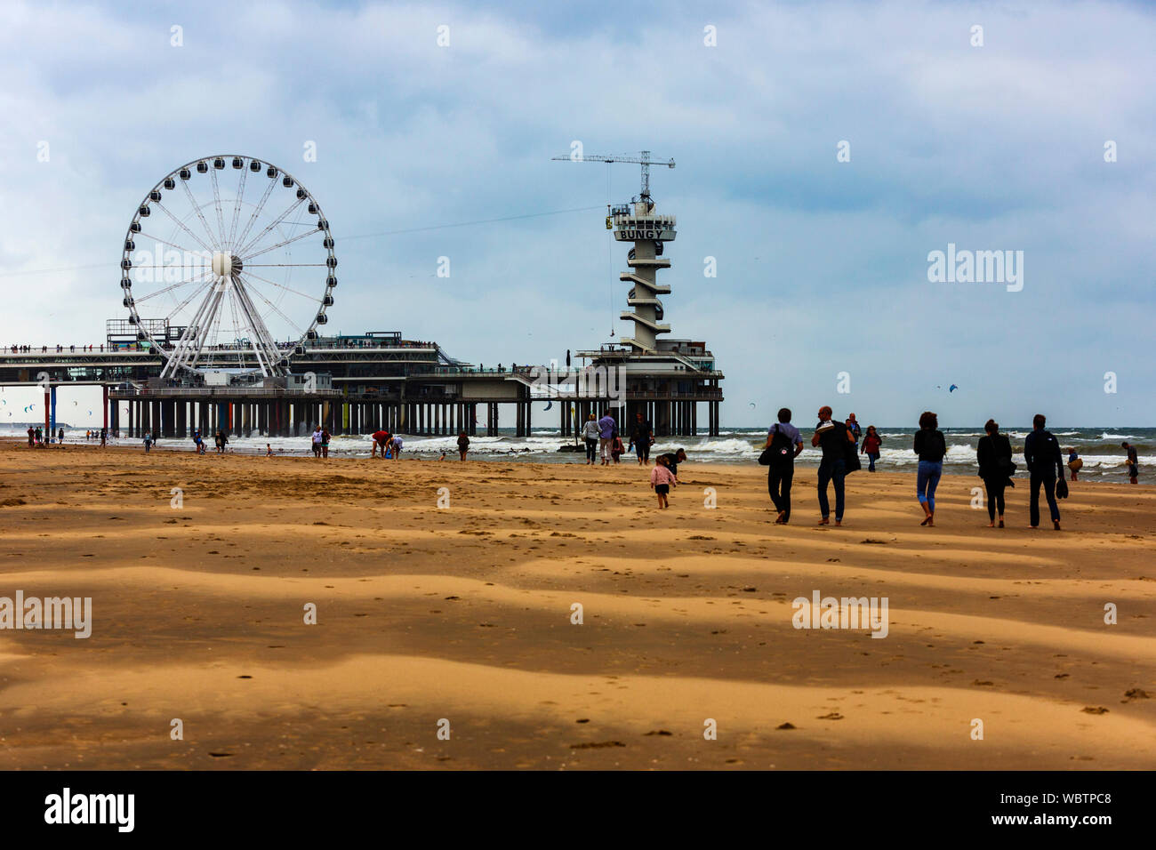 Beach with pier, bungy tower and ferris wheel, seaside resort of Scheveningen near The Hague, South Holland, Netherlands, Europe Stock Photo