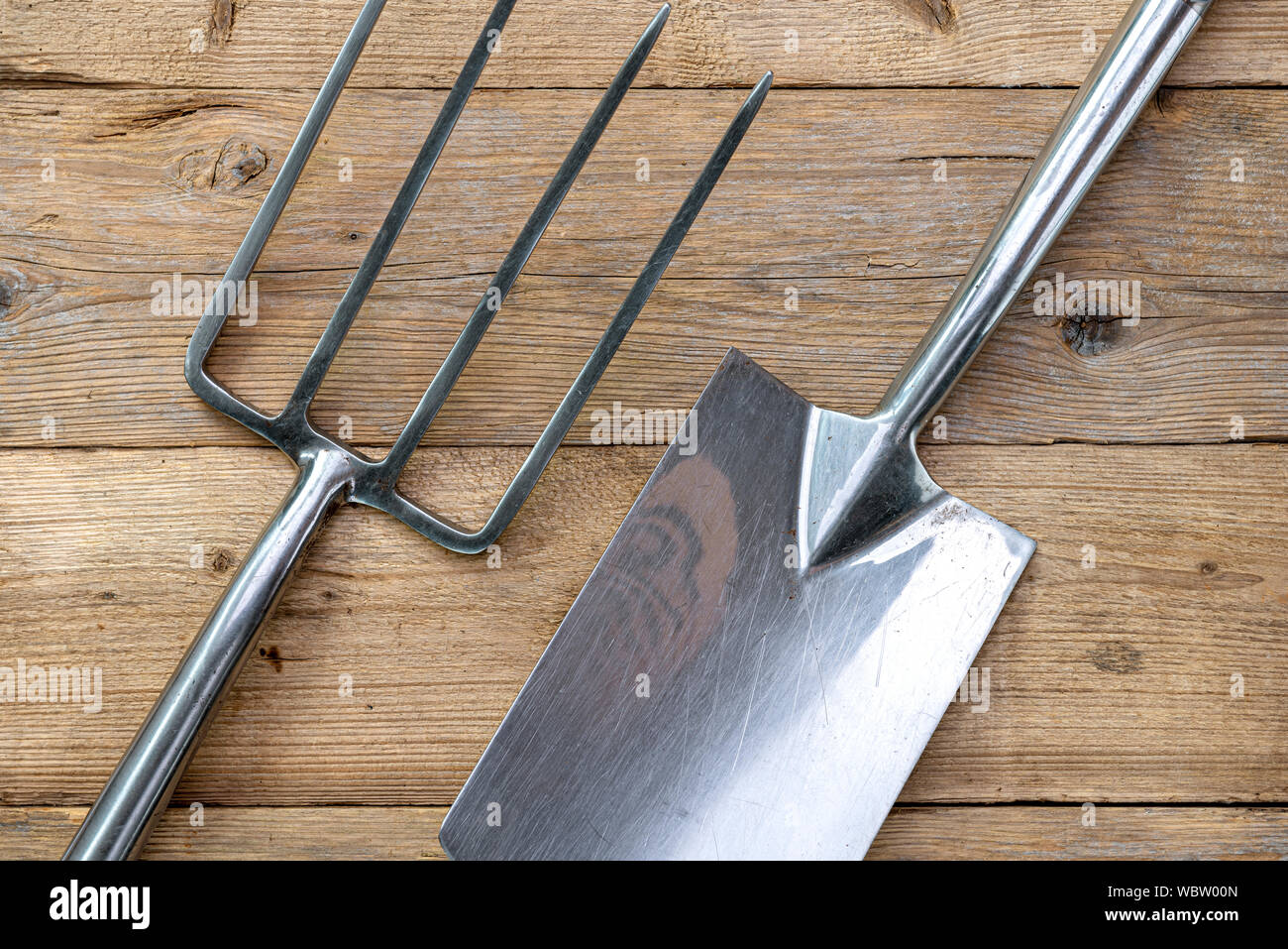 Garden Fork And Spade On A Wooden Background Stock Photo Alamy