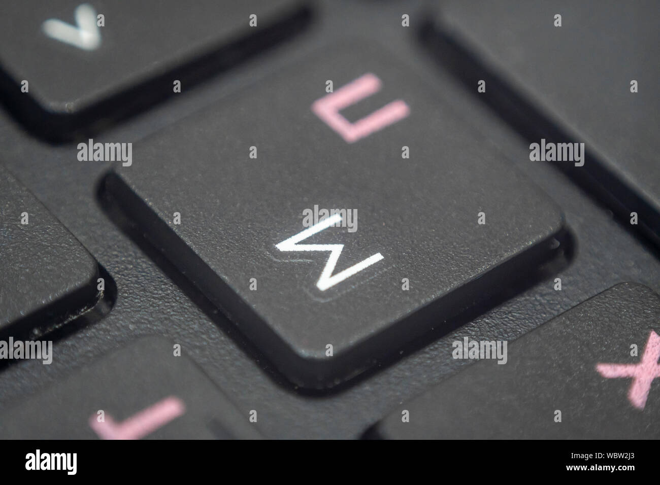 Extreme macro of the letter M on a laptop keyboard Stock Photo - Alamy