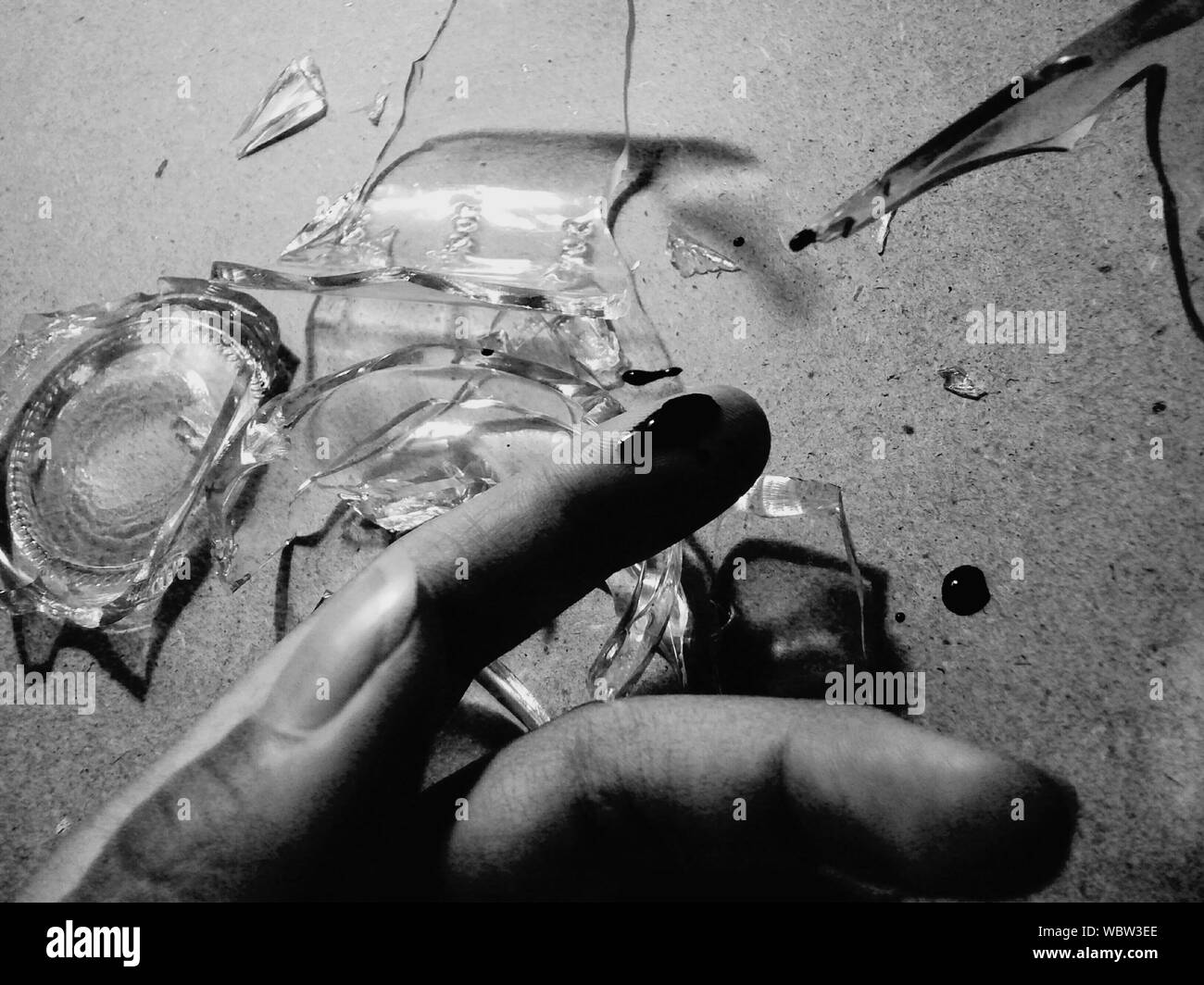 Cropped Image Of Hand With Blood Against Broken Glass On Floor Stock Photo  - Alamy
