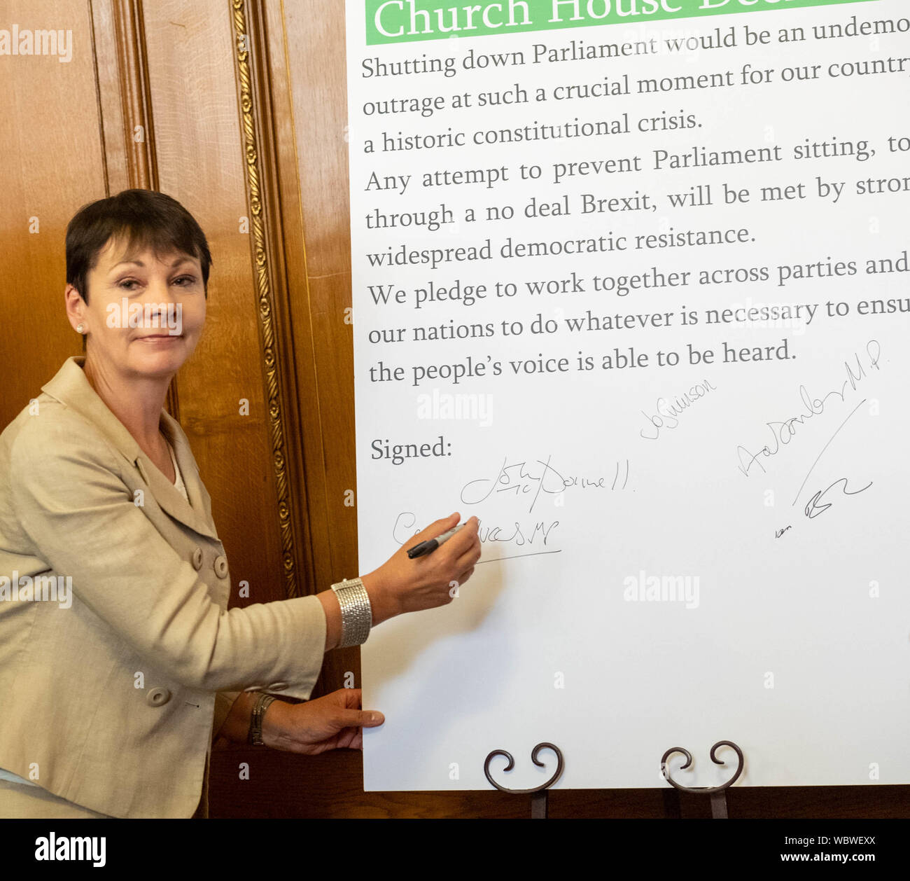 London, UK. 27 August 2019.  Church House declaration meeting of UK opposition leaders and MP's signing a declaration against the shutting down of parliament by Boris Johnson MP PC Prime Minister. Caroline Lucas, the only Green Party MP sighs the Declaration  Credit Ian DavidsonAlamy Live News Stock Photo