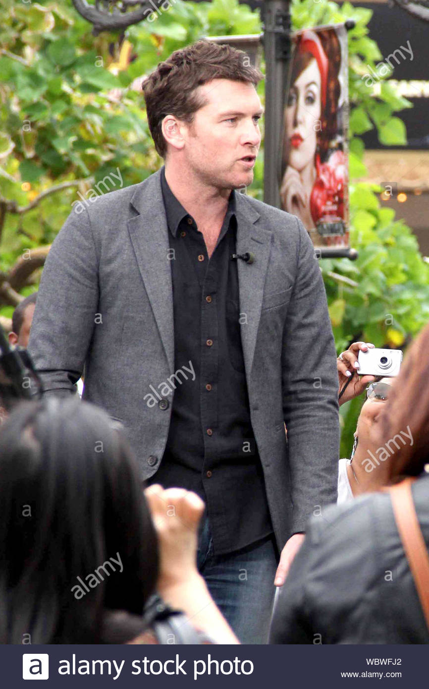 blue jeans black shirt grey blazer
