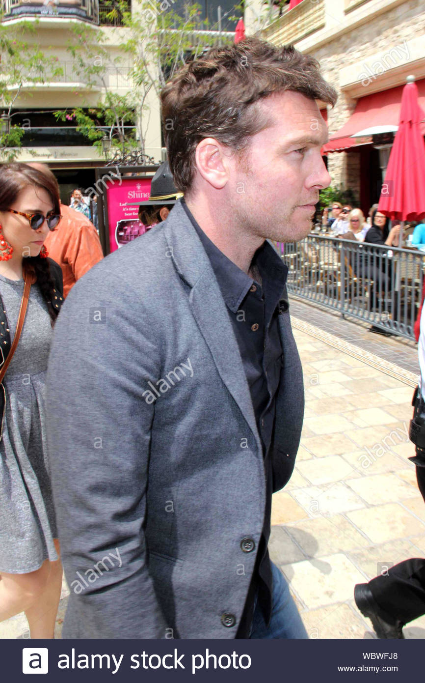 blue jeans black shirt grey blazer