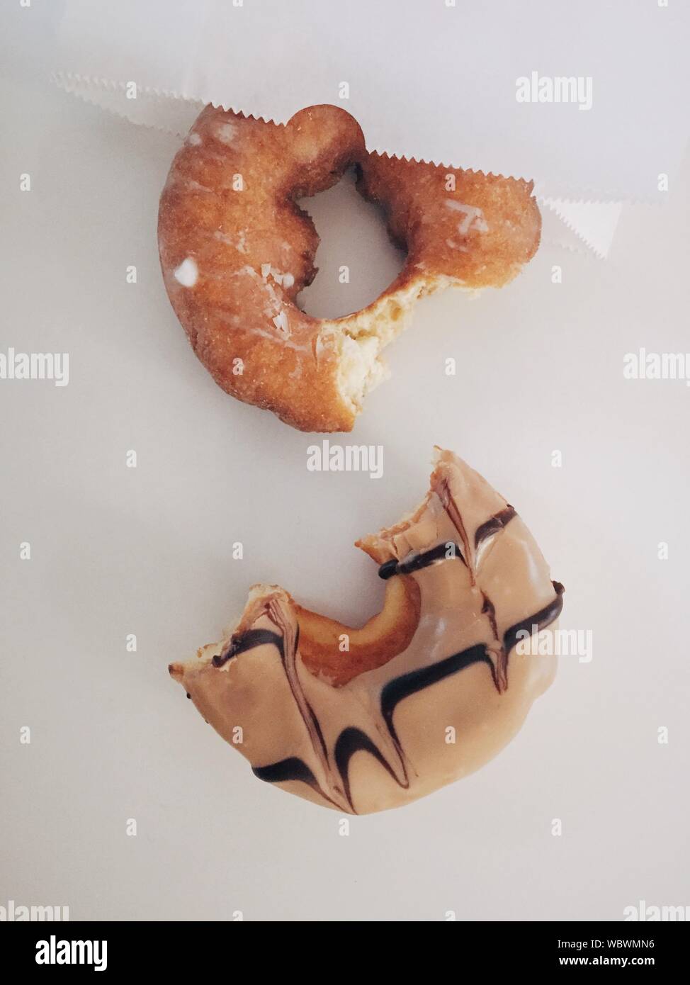 Half Eaten Donut On White Background Stock Photo Alamy