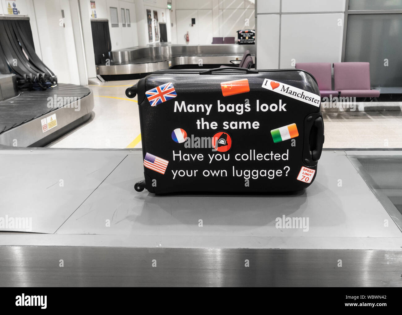A reminder to passengers waiting for luggage at airport carousel to pick up correct suitcase