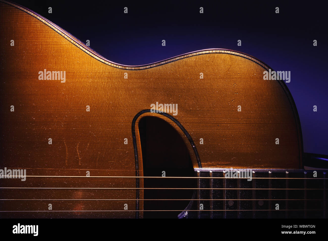 Details of an old and dusty gypsy jazz acoustic guitar, Django style. Stock Photo