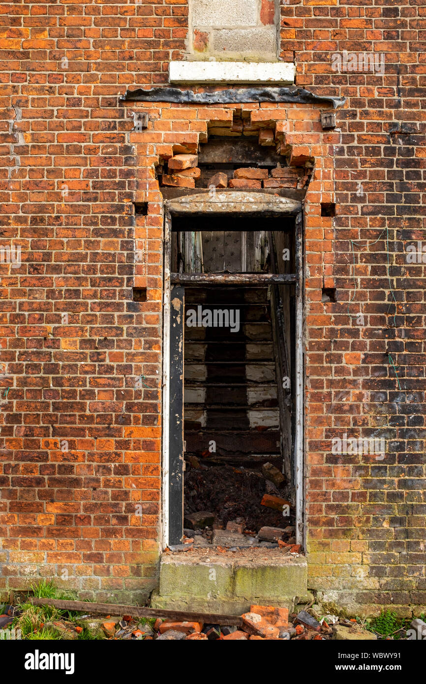 Front door to derelict house UK Stock Photo