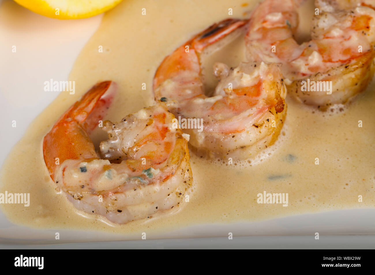 Prawn in cream sauce with rucola Stock Photo - Alamy