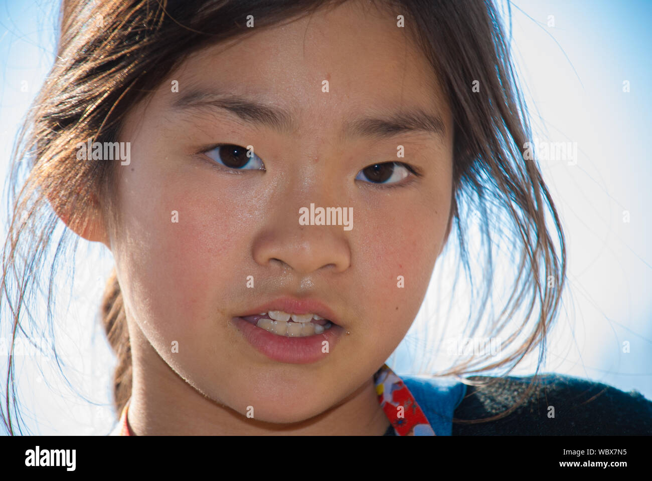 Close-up Portrait Of Pre-adolescent Girl Stock Photo