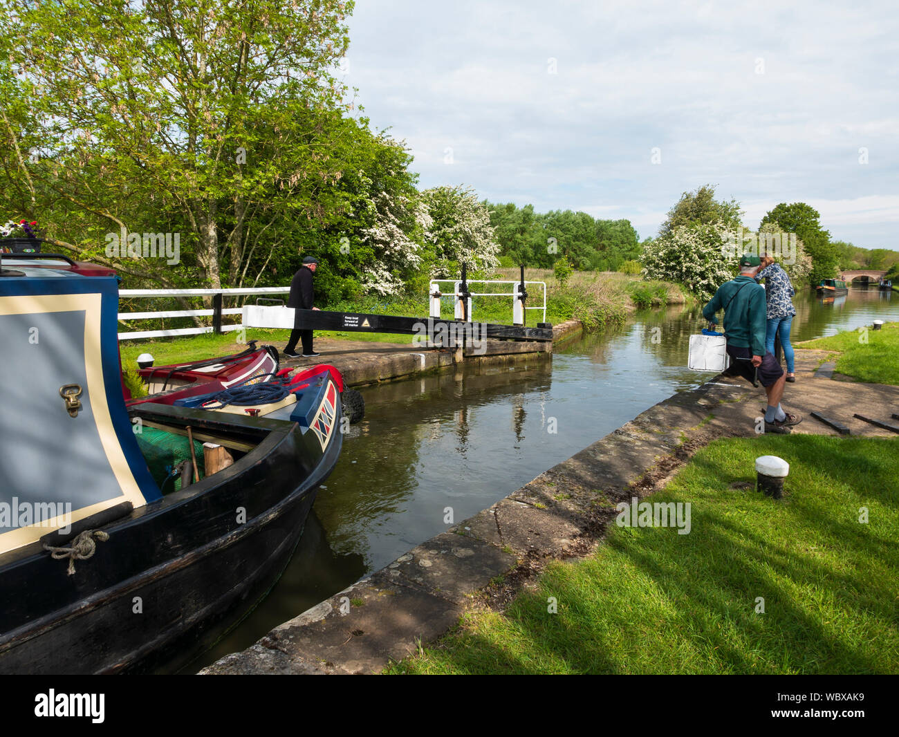 Canal boat in a lock, The Grand Union Canal, Northamptonshire, England, UK. Stock Photo