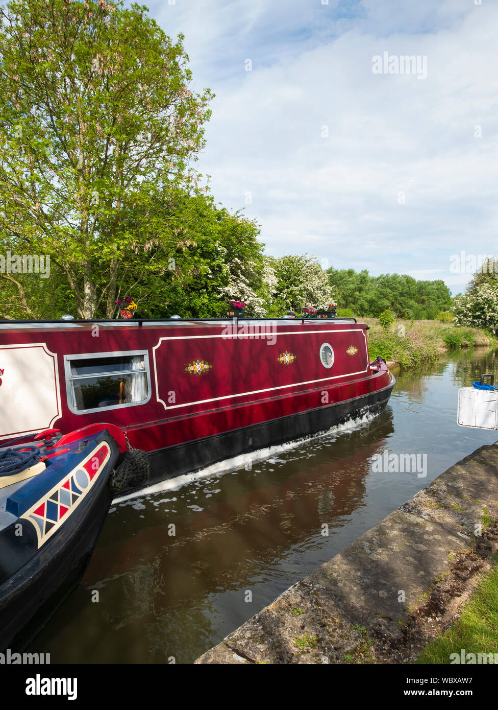 Canal boat in a lock, The Grand Union Canal, Northamptonshire, England, UK. Stock Photo