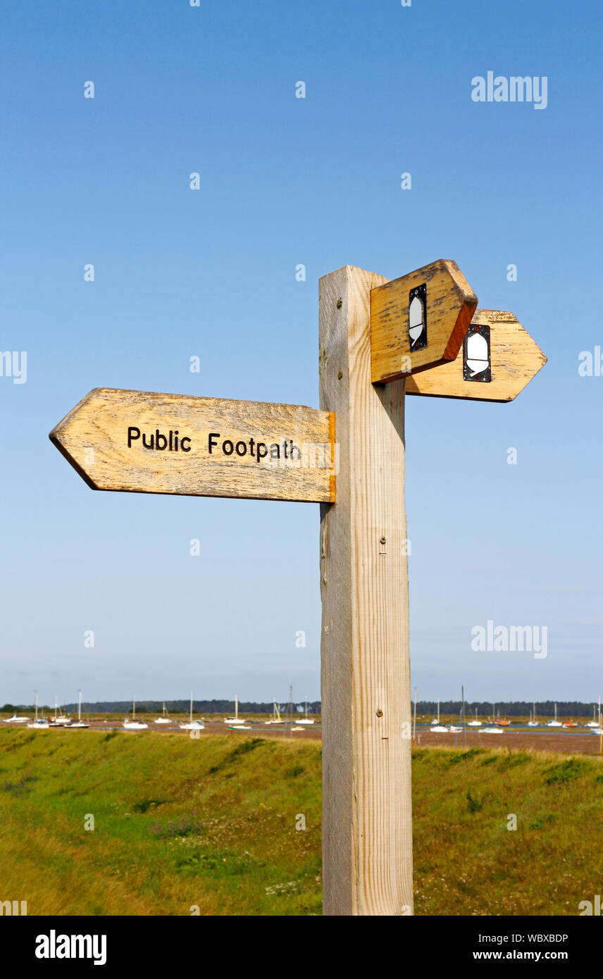 A signpost indicating public footpath and Norfolk Coast Path in North Norfolk at Wells-next-the-Sea, Norfolk, England, United Kingdom, Europe. Stock Photo