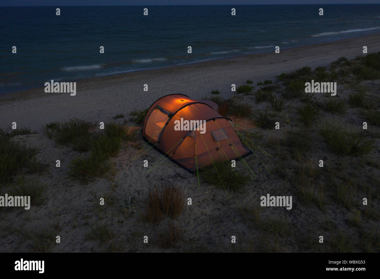 a camping tent on a beach near Black sea at evening Stock Photo