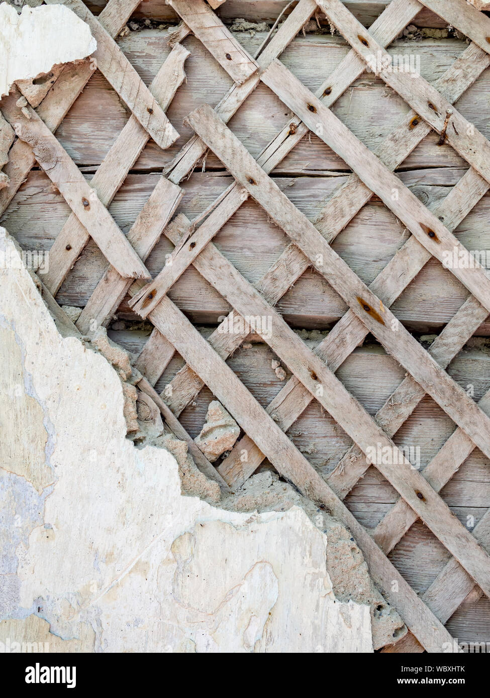 Old wooden shingled plaster wall Stock Photo