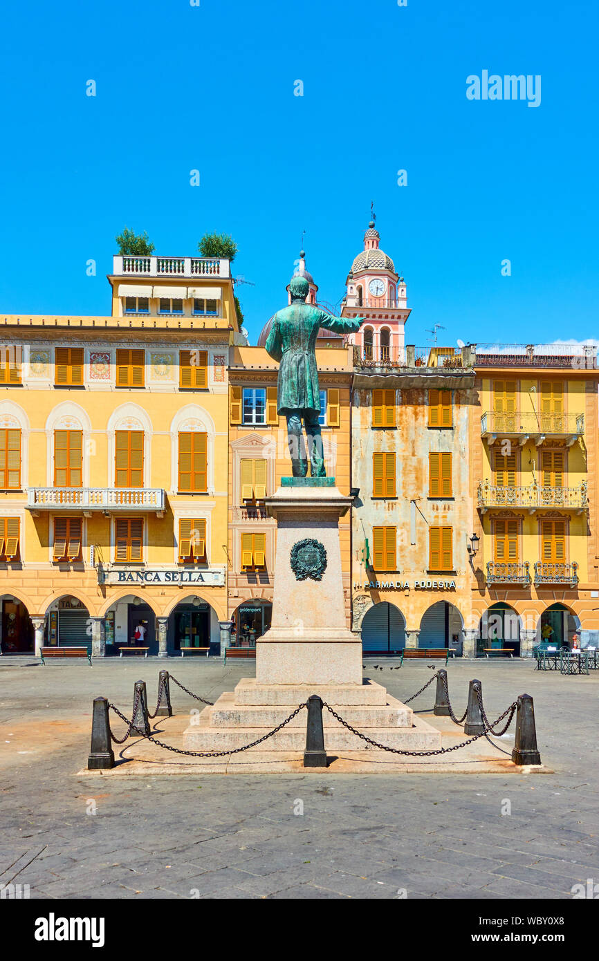 Chiavari,  Italy - July 3, 2019: Old square with monument to Giuseppe Mazzini  in Chiavari town near Genoa on sunny summer day, Liguria Stock Photo