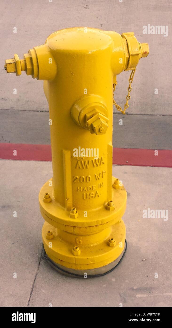 Close Up Of Yellow Fire Hydrant On Footpath Stock Photo Alamy