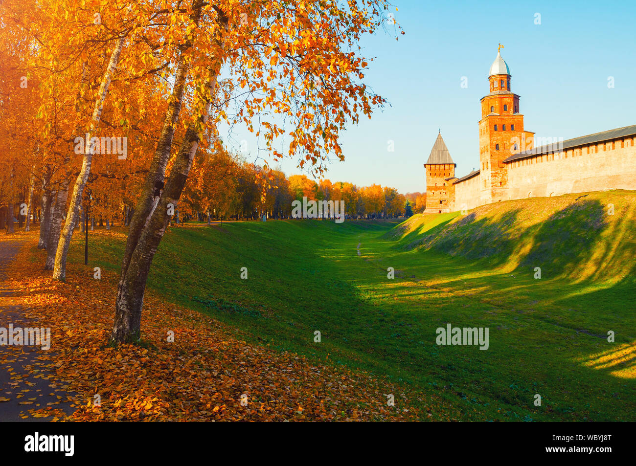 Veliky Novgorod, Russia. Kokui and Prince towers of Veliky Novgorod Kremlin at autumn sunny day. Focus at the Kremlin towers. Autumn city landscape Stock Photo