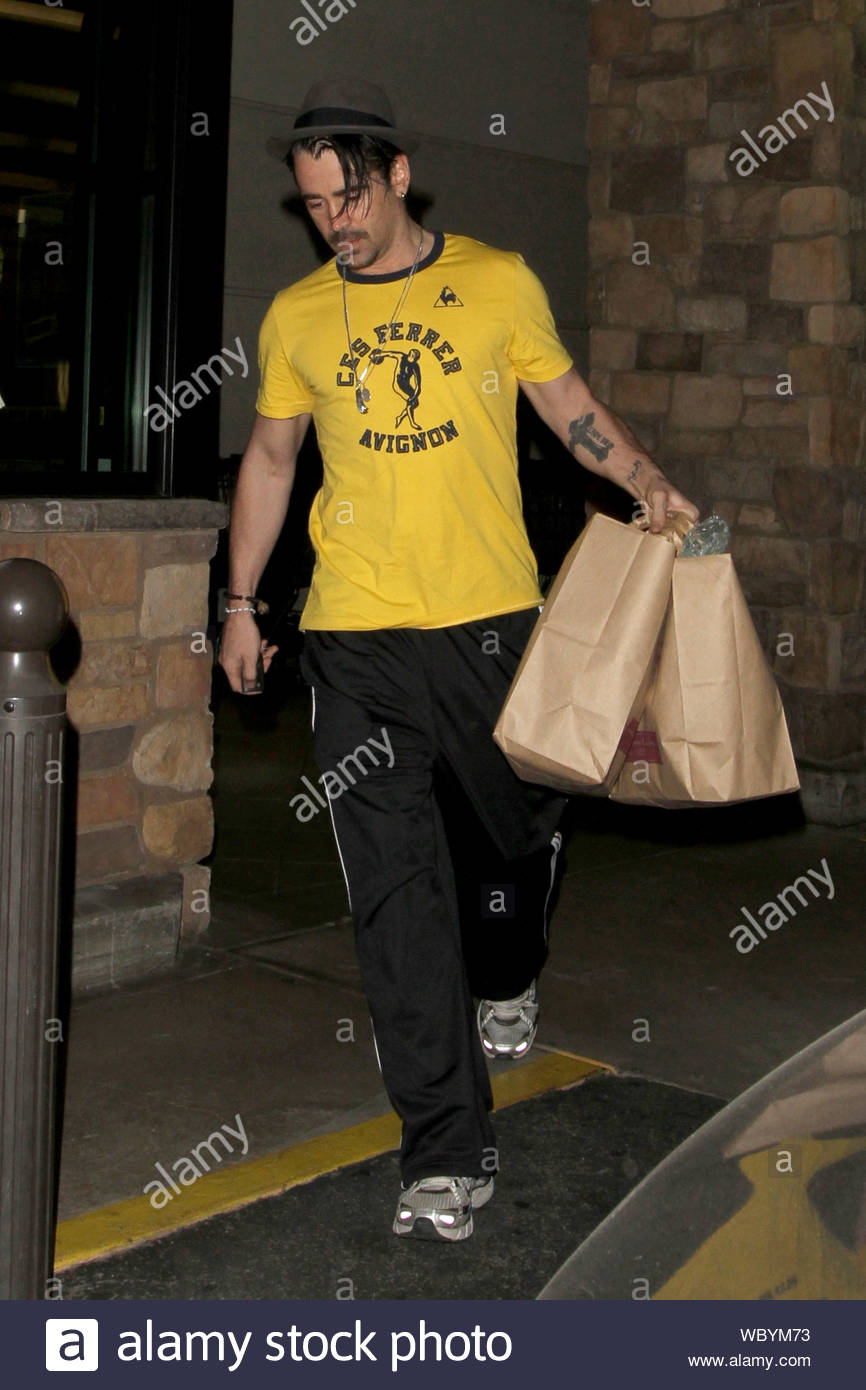 Los Angeles, CA - Actor Colin Farrell steps out for a grocery run at  Gelsons today, walking out with two bags of goodies while his sister,  Claudine, waited in the car. The "