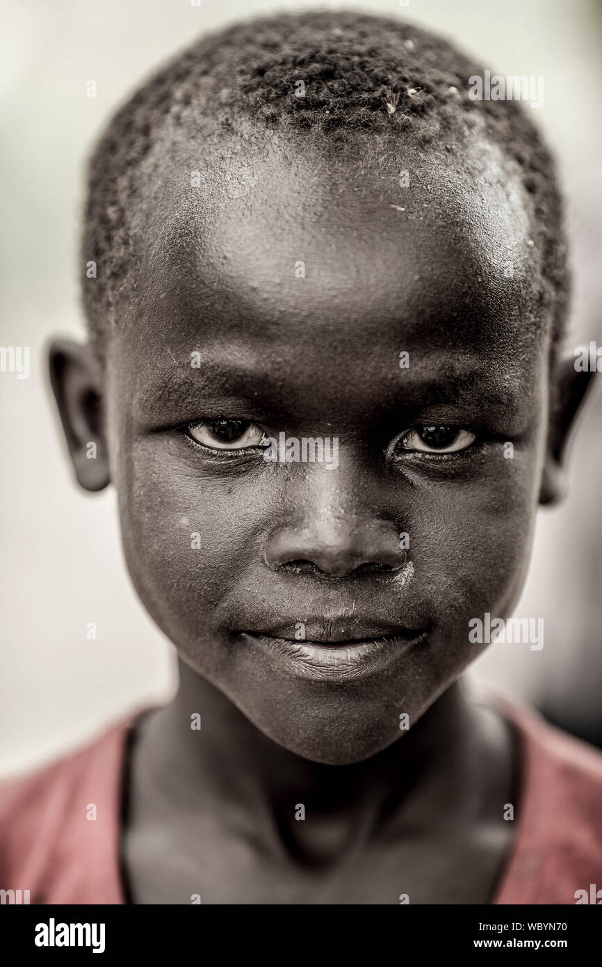 BOR, SOUTH SUDAN-NOVEMBER 4, 2013: Portrait of an unidentified South Sudanese boy with determined expression Stock Photo