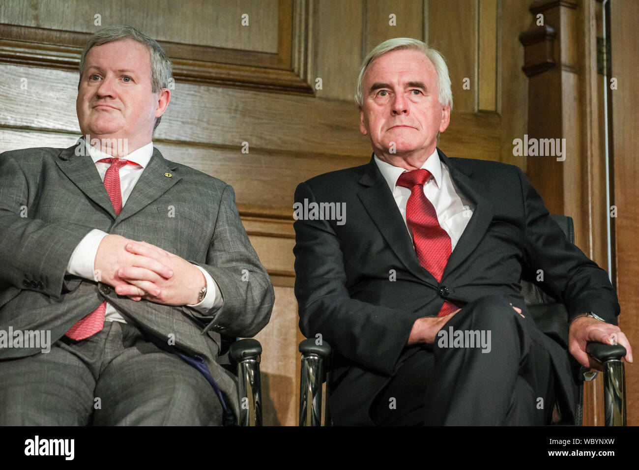 London, UK. 27th Aug, 2019. Ian Blackford, SNP, and John McDonnell, Labour.  Cross-party MPs and opposition party leaders assemble in the historic  location of Church House in London to sign their 'Church