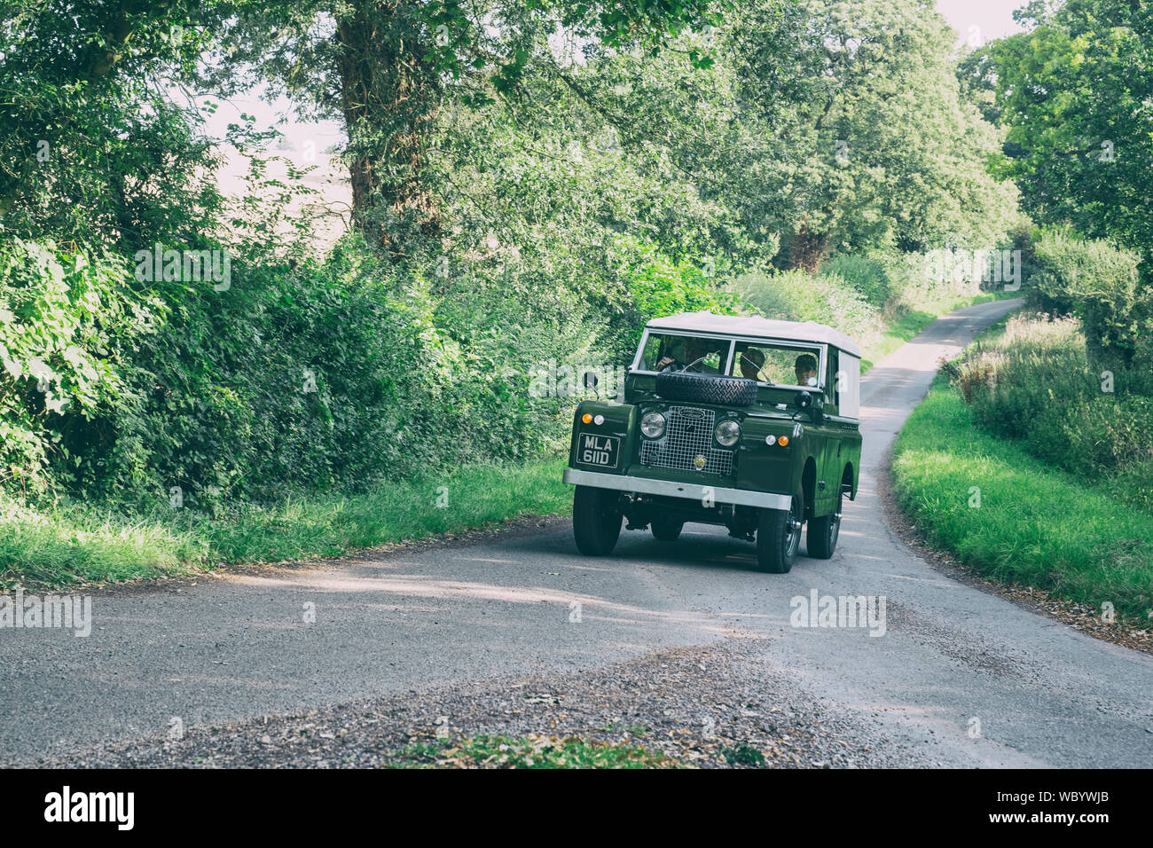 1966 Land Rover Series IIA  going to a classic car show in the Oxfordshire countryside. Broughton, Banbury, England. Vintage filter applied Stock Photo