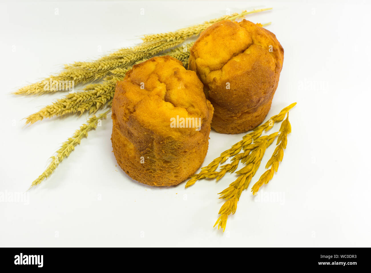 High Angle View Of Muffins With Wholegrain On White Background Stock Photo