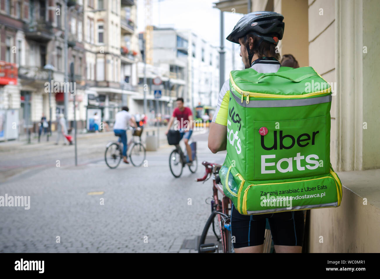 Uber Eats delivery service in town. Stock Photo