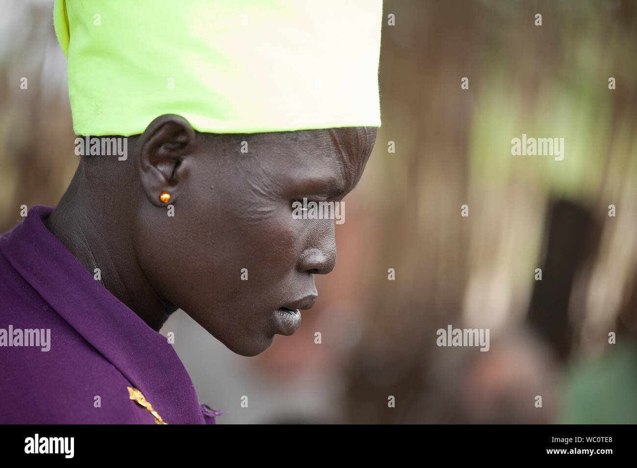 PANWELL, SOUTH SUDAN-NOVEMBER 2, 2013: An unidentified woman with facial scarification in the village of Panwell, South Sudan Stock Photo