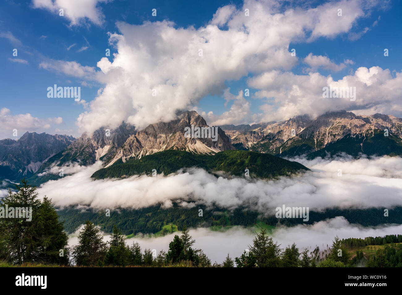 Dolomites above the clouds, Sesto South Tyrol Stock Photo