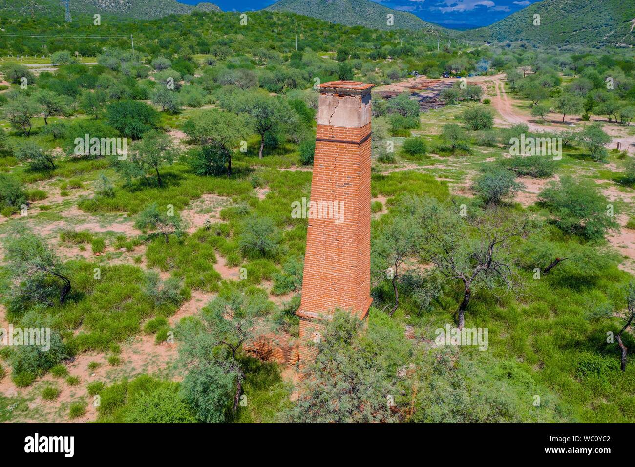 Aerial view of chimney or chacuaco of the sugar mill in El Gavilan Sonora. It is located around the country walk and ranch called El Gavilan, it is part of the Sonora River basin as it passes through the municipality of Hermosillo, Sonora Mexico. Sonora Desert. Sugar. old construction. Architect brick, landscape, rural, travel, (© Photo: LuisGutierrez / NortePhoto.com) Vista aerea de chimenea o chacuaco del ingenio azucarero en El Gavilan Sonora. Se encuentra en los alrededores del paseo campestre y rancho llamado el Gavilan, forma parte de la cuenca del Rio Sonora a su paso por el municipio d Stock Photo