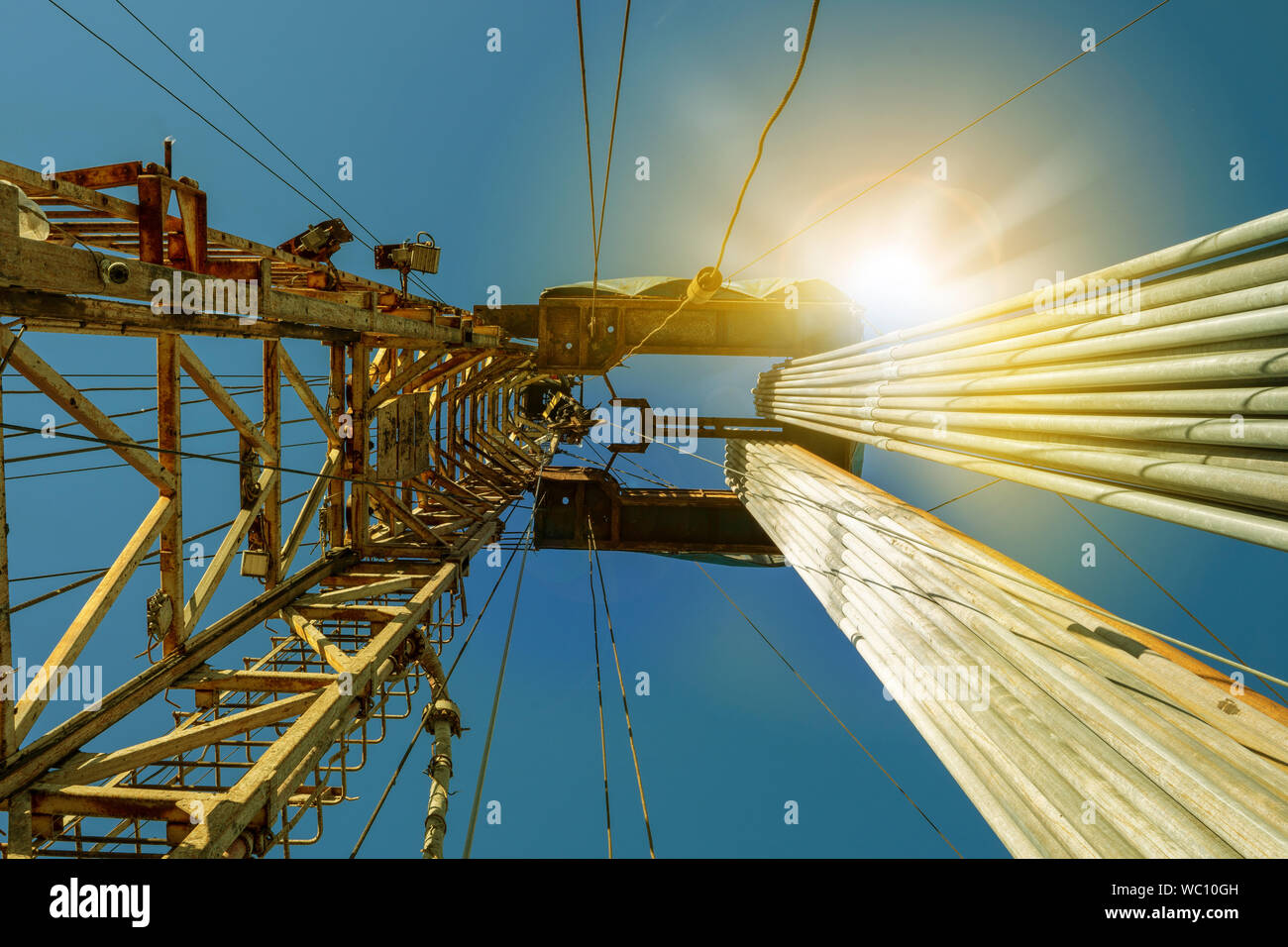 Onshore land rig in oil and gas industry. Oil drilling rig against a ...