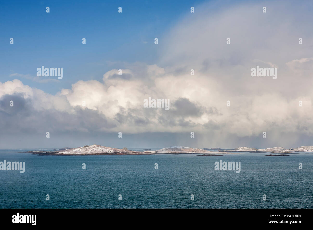Samson and the Western Rocks from the Garrison, St. Mary's, Isles of Scilly, UK, after a rare fall of snow Stock Photo