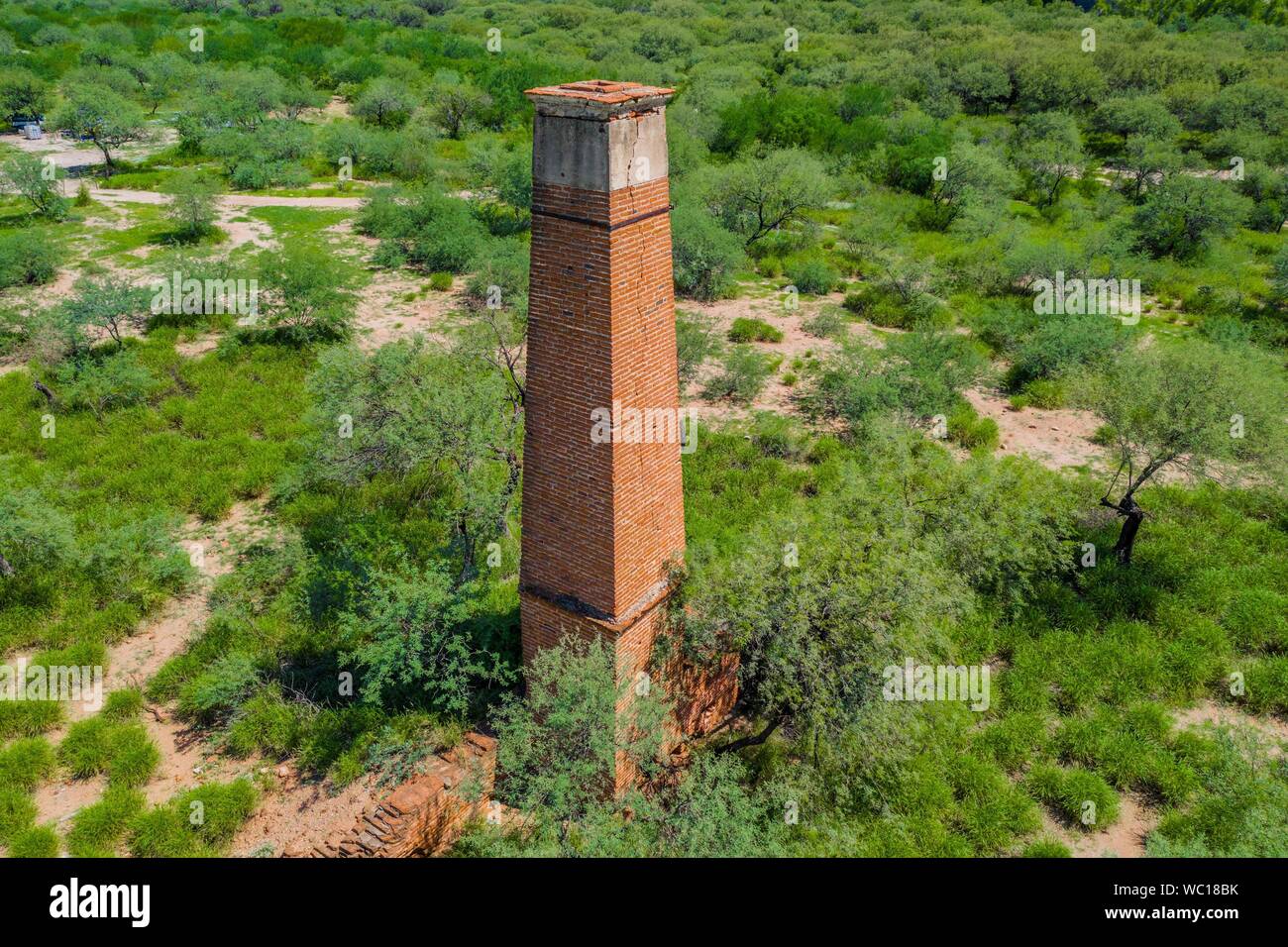 Aerial view of chimney or chacuaco of the sugar mill in El Gavilan Sonora. It is located around the country walk and ranch called El Gavilan, it is part of the Sonora River basin as it passes through the municipality of Hermosillo, Sonora Mexico. Sonora Desert. Sugar. old construction. Architect brick, landscape, rural, travel, (© Photo: LuisGutierrez / NortePhoto.com) Vista aerea de chimenea o chacuaco del ingenio azucarero en El Gavilan Sonora. Se encuentra en los alrededores del paseo campestre y rancho llamado el Gavilan, forma parte de la cuenca del Rio Sonora a su paso por el municipio d Stock Photo