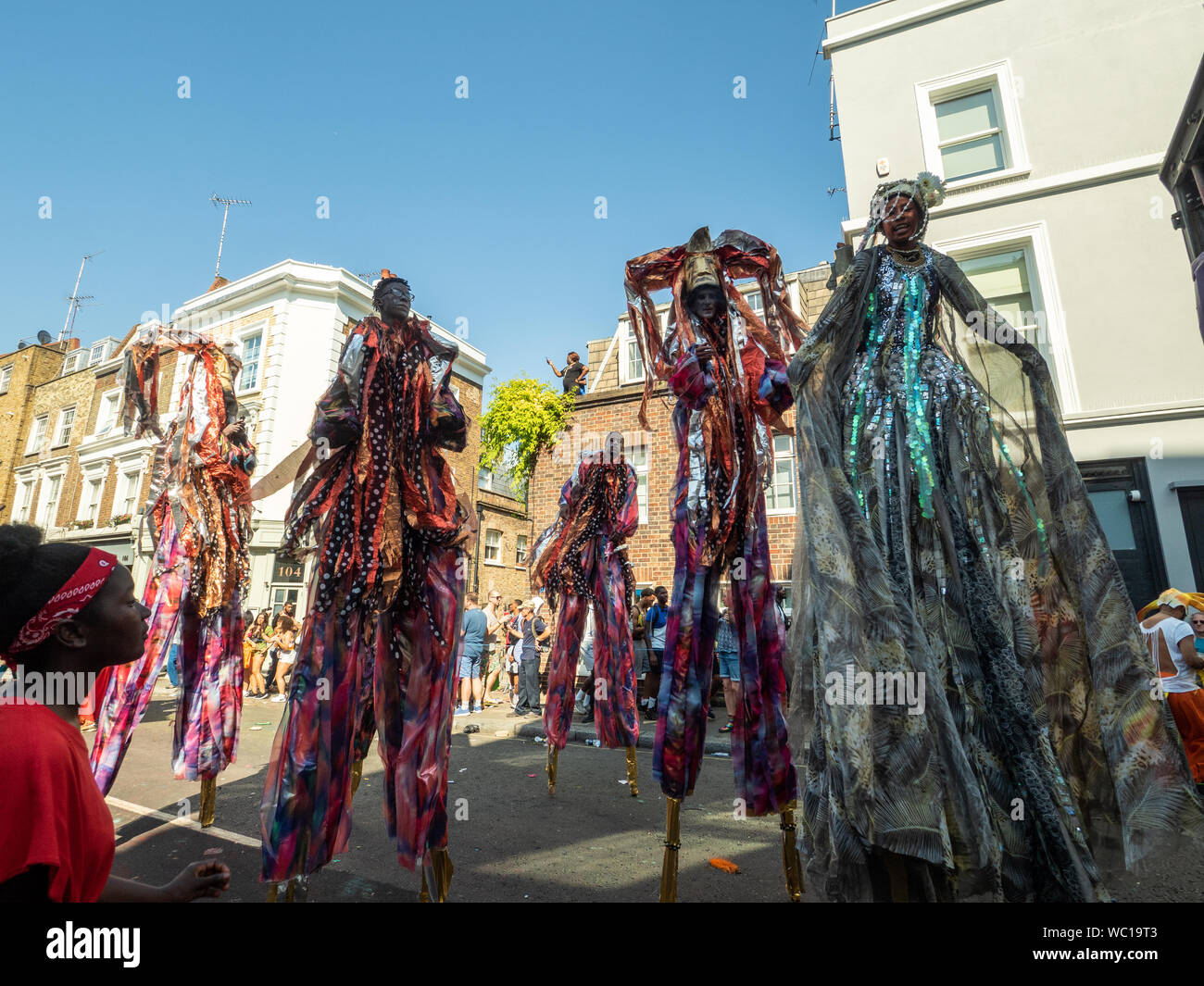 Performers on stilts at the Notting Hill Carnival London Stock Photo