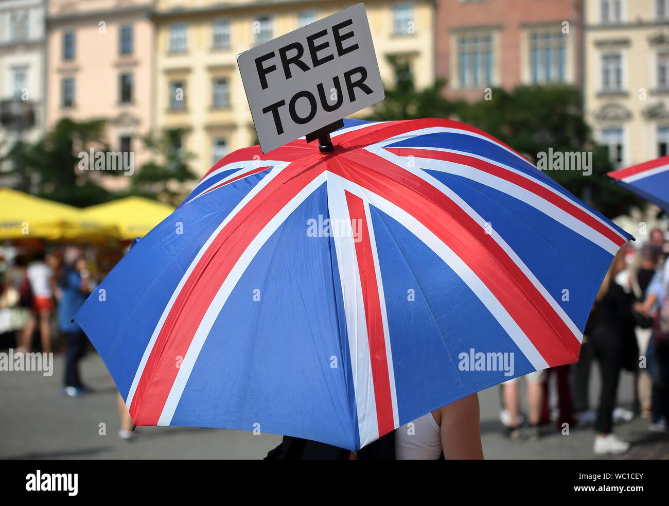 Umbrella with national colours of Union Jack  / Union flag with information on board at the top free tour, CLOSE UP, in city center Stock Photo
