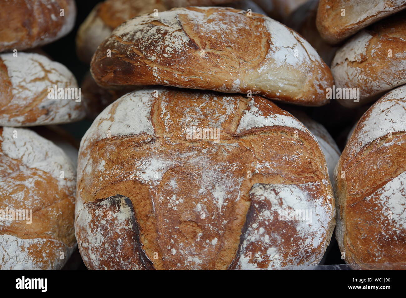 Stack of traditionall backed big bread loaf, hand made, close up. Stock Photo
