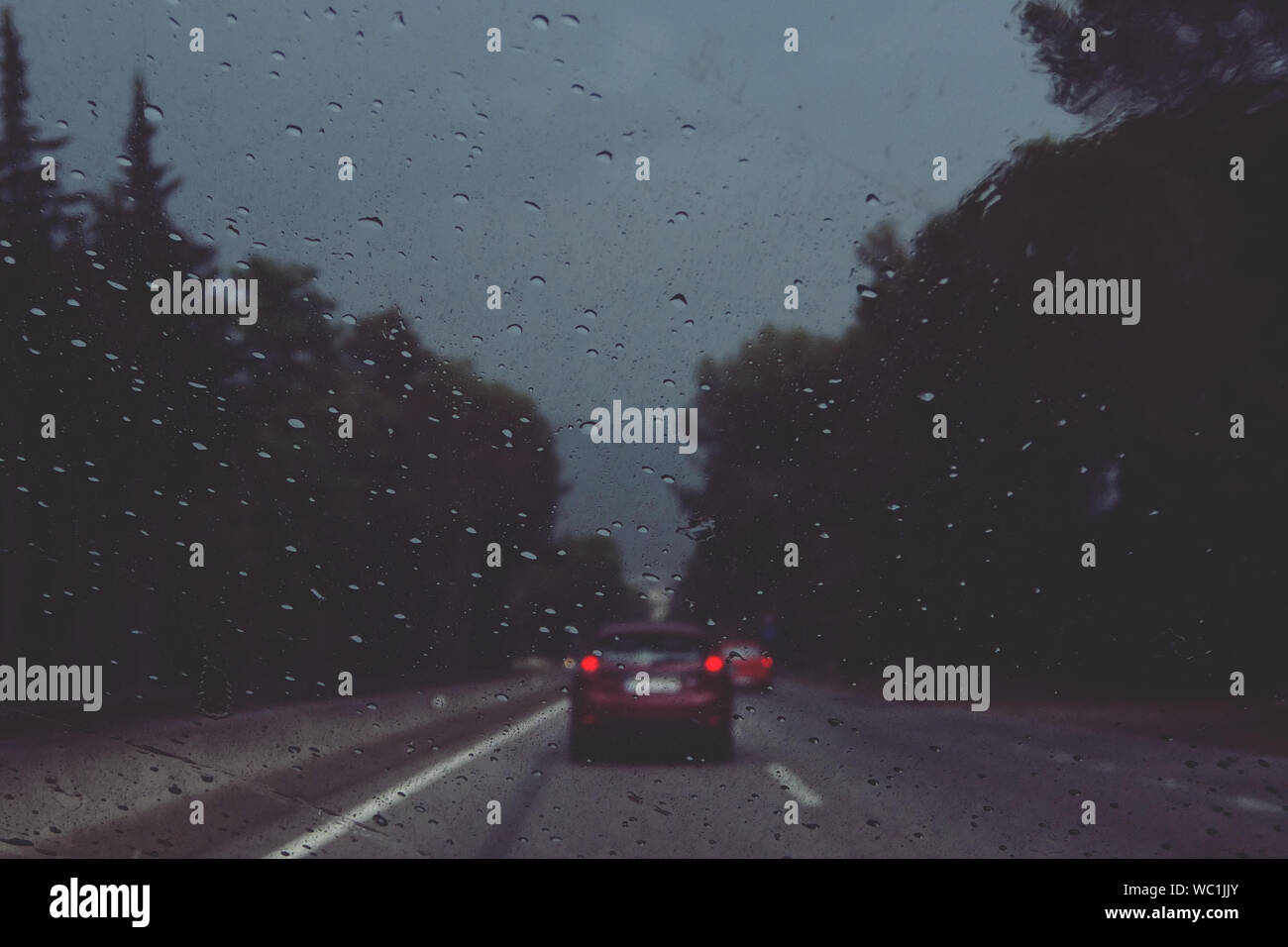 View Of Road Through Wet Windshield Stock Photo Alamy