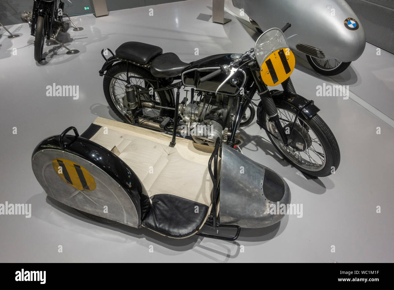 A BMW RS54 Sidecar ridden by Wilhelm Noll & Fritz Cron, part of the historical BMW racing motorcycles display, BMW Museum, Munich, Bavaria, Germany. Stock Photo