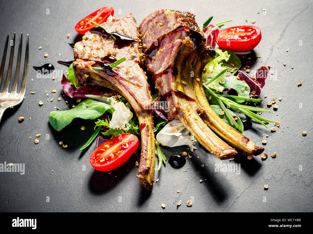 Grilled rack of lamb on slate plate, top view Stock Photo