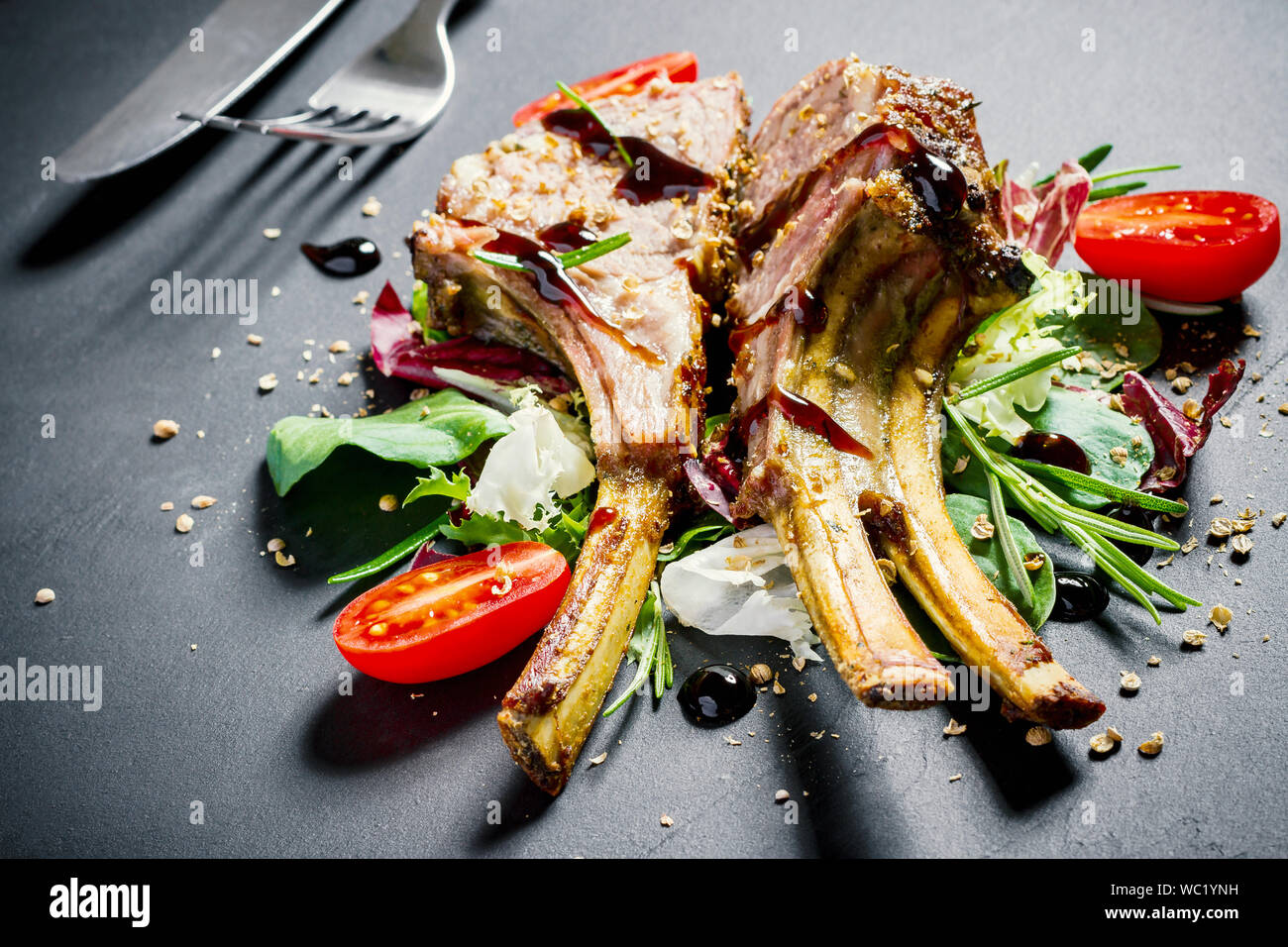 Grilled rack of lamb on slate plate, top view Stock Photo