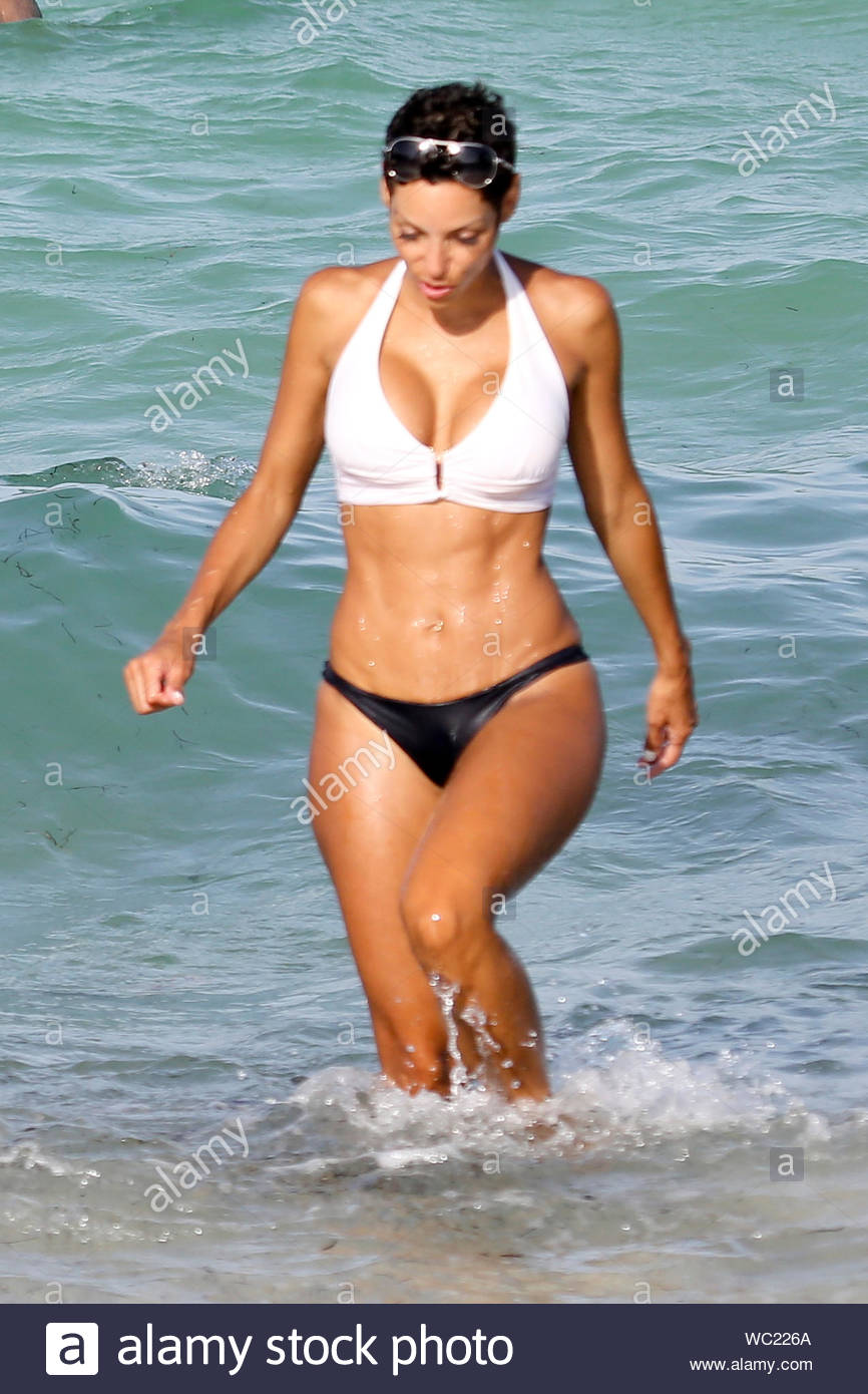 Miami, FL - Claudia Jordan and Nicole Murphy hang out at South Beach,  showing off their bikini bodies and taking a cool dip in the water. The  "Celebrity Apprentice" star donned a
