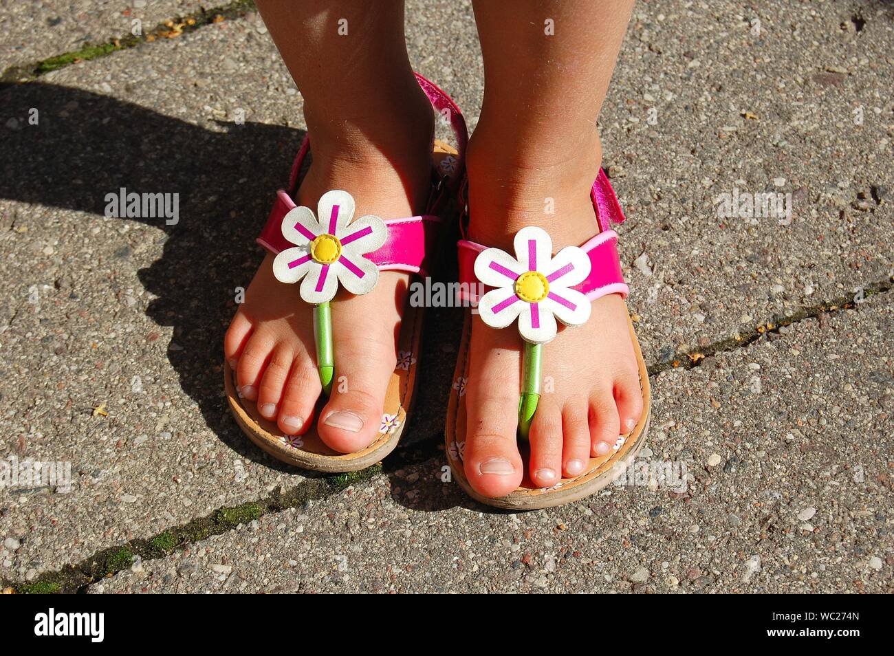 Girl's feet in sandals hi-res stock photography and images - Alamy